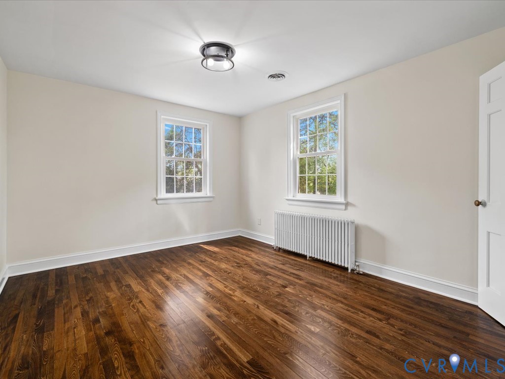 4803 Morrison Road Richmond, VA 23230 - Photo 33 of 45 an empty room with wooden floor and windows