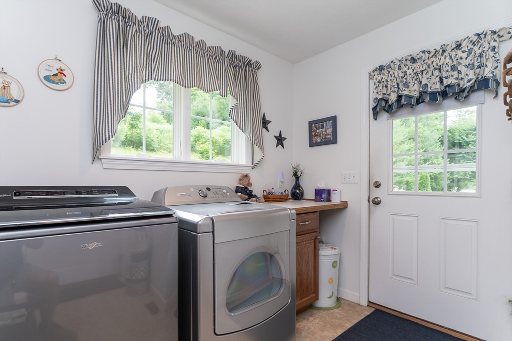 216 Palmer Road Brimfield, MA 01010 - Photo 18 of 25 a view of a kitchen with washer and dryer