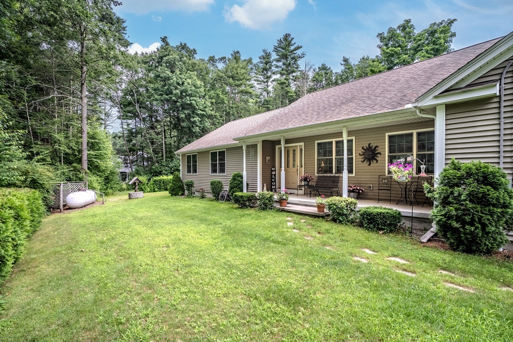 216 Palmer Road Brimfield, MA 01010 - Photo 2 of 25 a view of a house with a backyard and porch