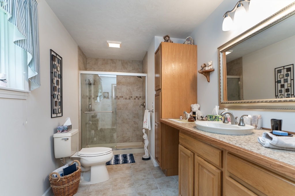 216 Palmer Road Brimfield, MA 01010 - Photo 21 of 25 a bathroom with a sink toilet and shower