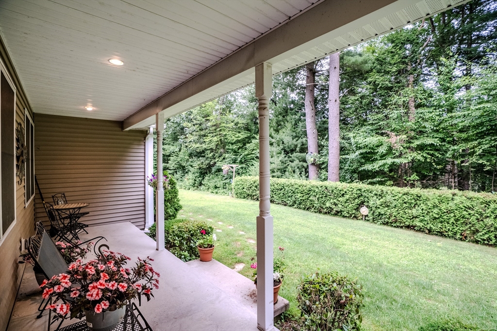 216 Palmer Road Brimfield, MA 01010 - Photo 4 of 25 a view of a porch with furniture and garden