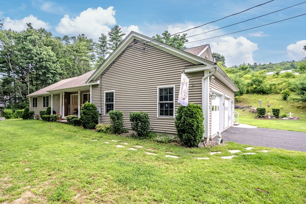 216 Palmer Road Brimfield, MA 01010 - Photo 5 of 25 a view of a house with a yard