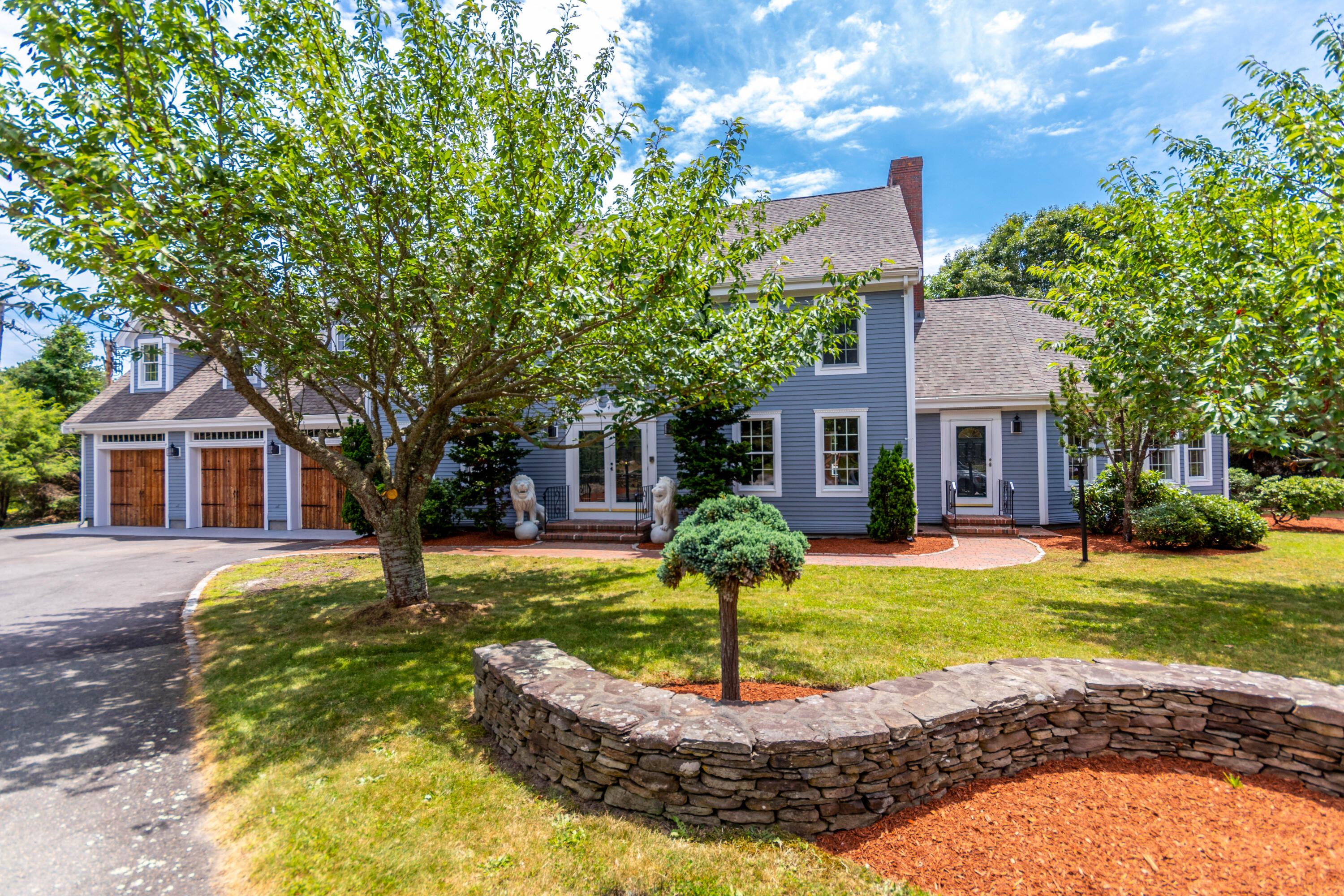 Front of 4 bedroom Coloial with 3 car ga