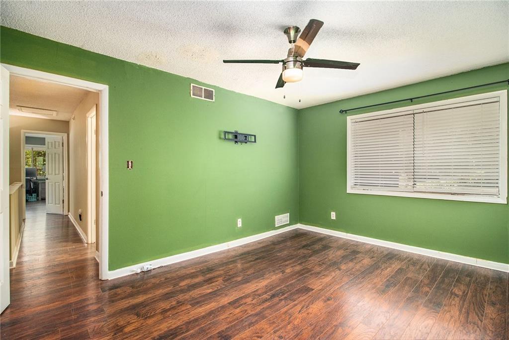 4 Quail Run Decatur, GA 30035 - Photo 15 of 23 a view of empty room with wooden floor and fan