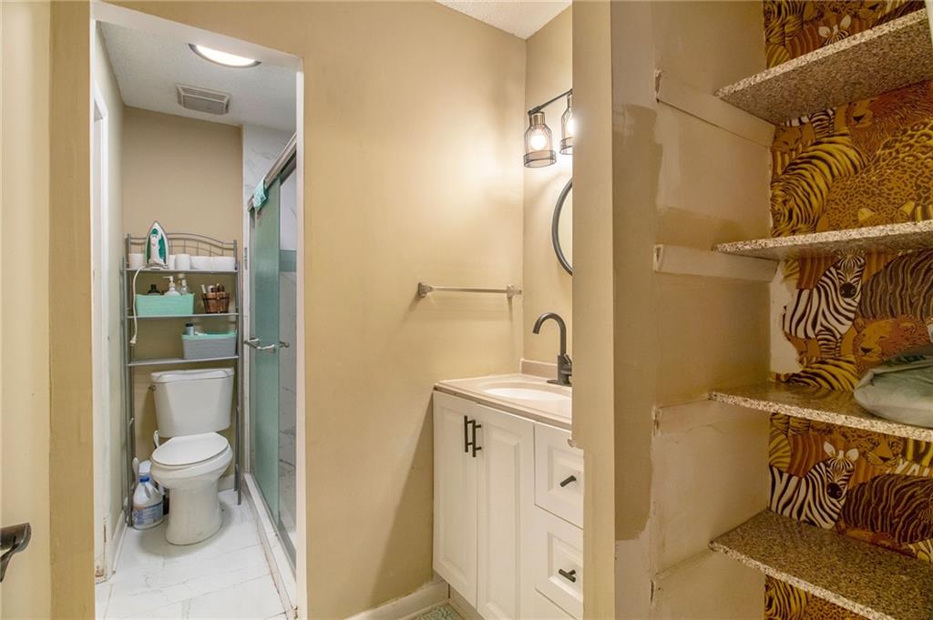4 Quail Run Decatur, GA 30035 - Photo 17 of 23 a bathroom with a sink and a mirror