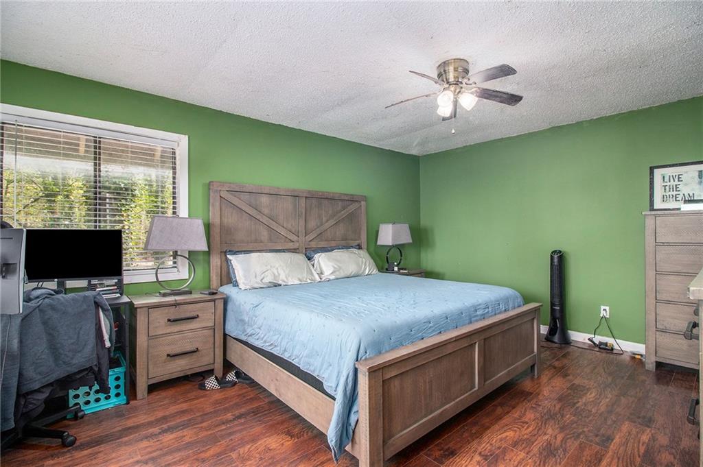 4 Quail Run Decatur, GA 30035 - Photo 18 of 23 a bedroom with a bed and a flat screen tv