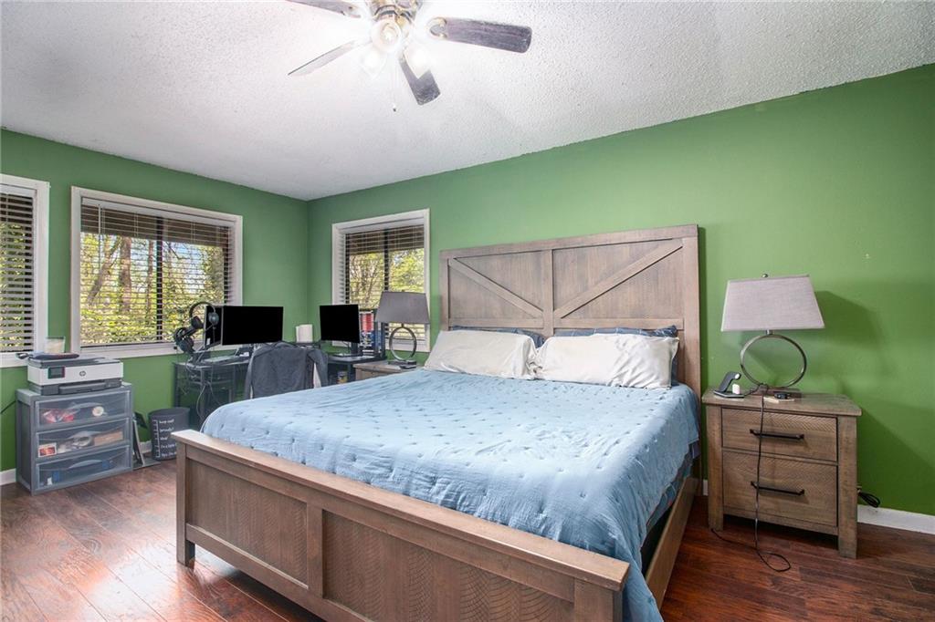 4 Quail Run Decatur, GA 30035 - Photo 19 of 23 a bedroom with a bed and wooden floor