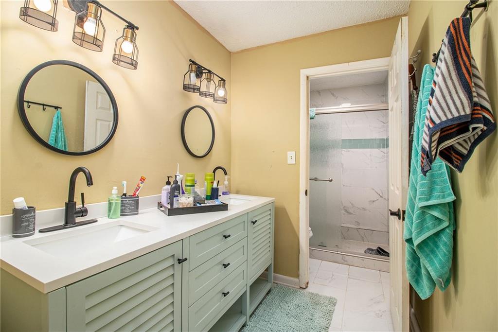 4 Quail Run Decatur, GA 30035 - Photo 20 of 23 a bathroom with a double vanity sink and a mirror