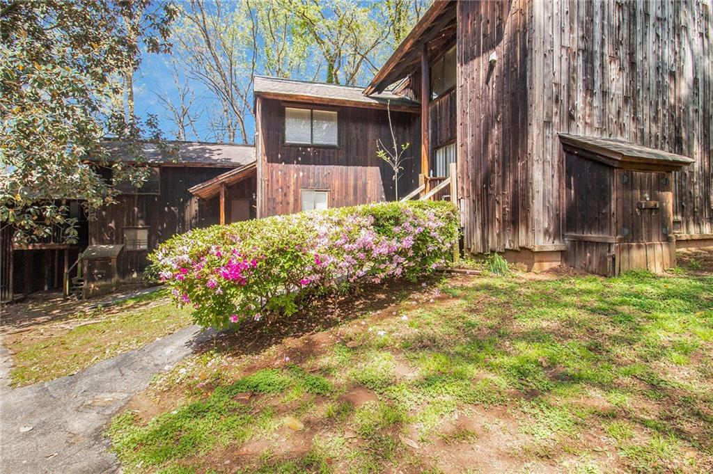 4 Quail Run Decatur, GA 30035 - Photo 2 of 23 a view of a house with a yard and potted plants