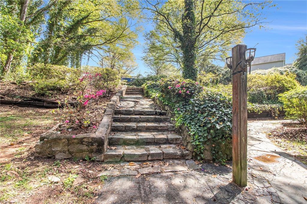 4 Quail Run Decatur, GA 30035 - Photo 22 of 23 a view of a pathway of a yard with plants and large trees