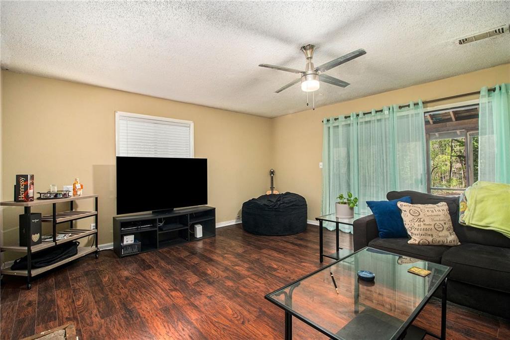 4 Quail Run Decatur, GA 30035 - Photo 4 of 23 a living room with furniture and a flat screen tv