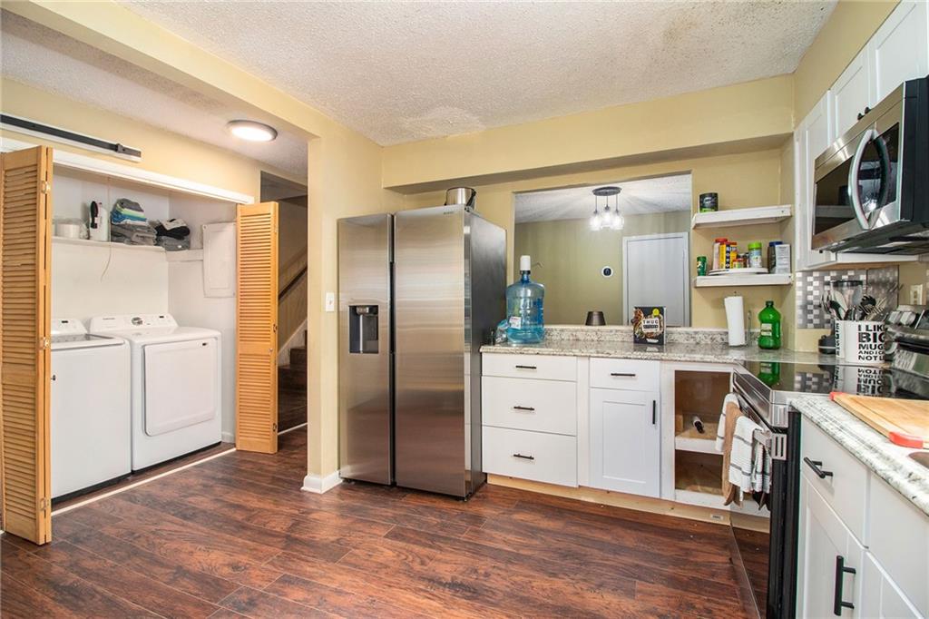 4 Quail Run Decatur, GA 30035 - Photo 7 of 23 a kitchen with stainless steel appliances a refrigerator sink and cabinets
