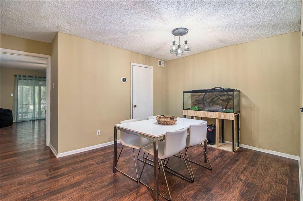 4 Quail Run Decatur, GA 30035 - Photo 9 of 23 a view of a dining room with furniture and wooden floor