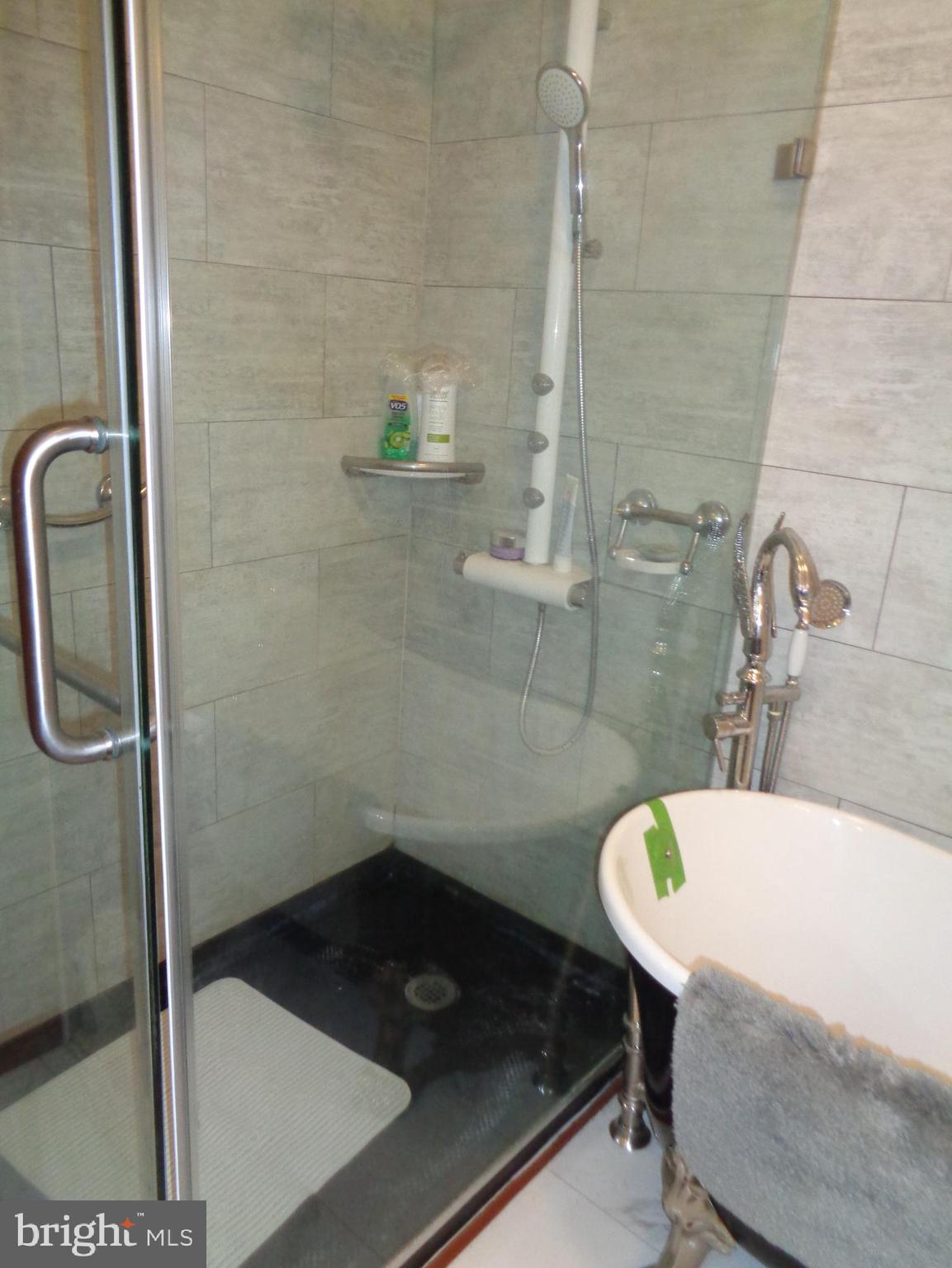 27174 Champ Wharf Road Princess Anne, MD 21853 - Photo 18 of 32 a bathroom with a sink and a shower