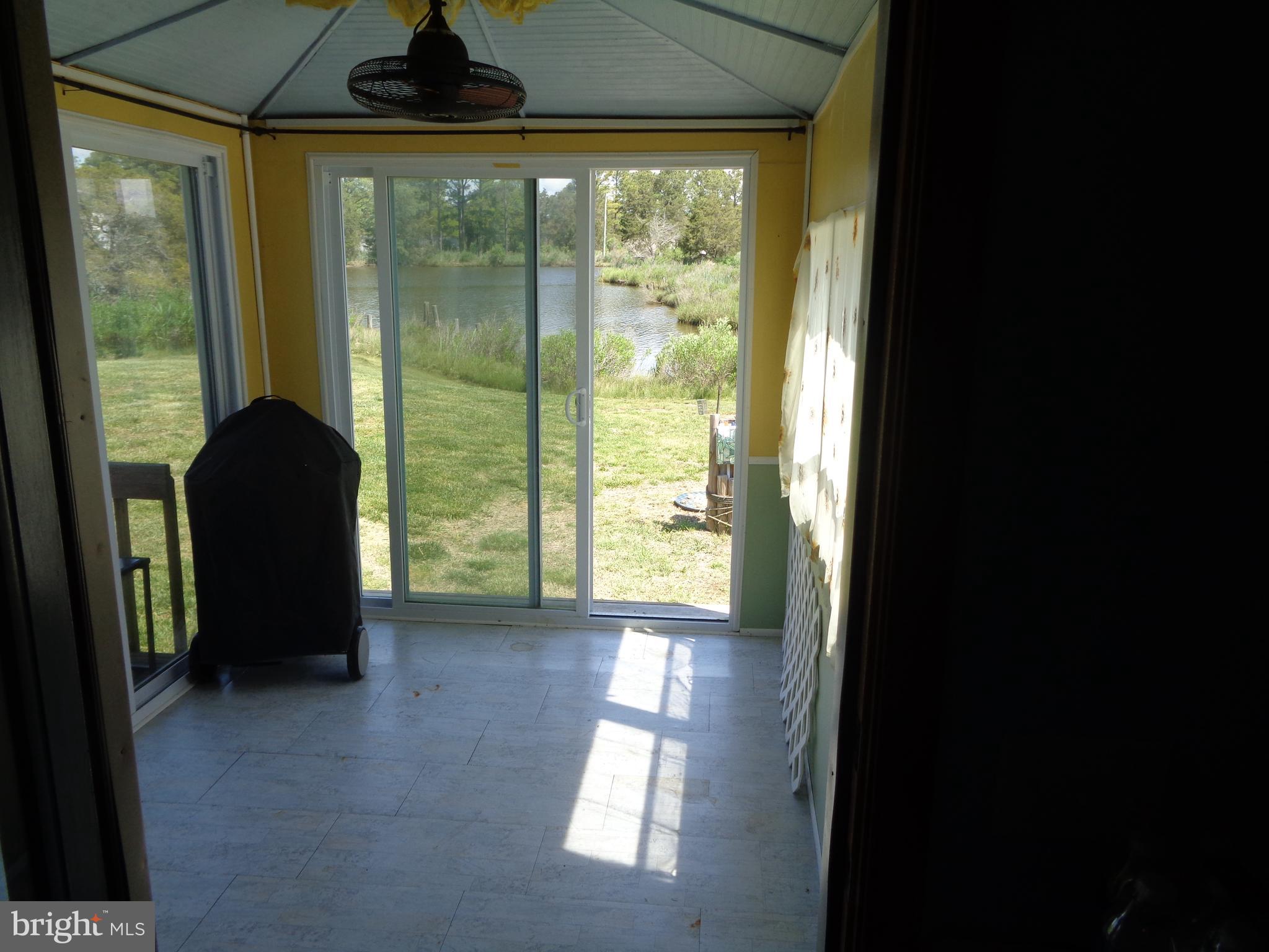 27174 Champ Wharf Road Princess Anne, MD 21853 - Photo 26 of 32 a view of an empty room and a window