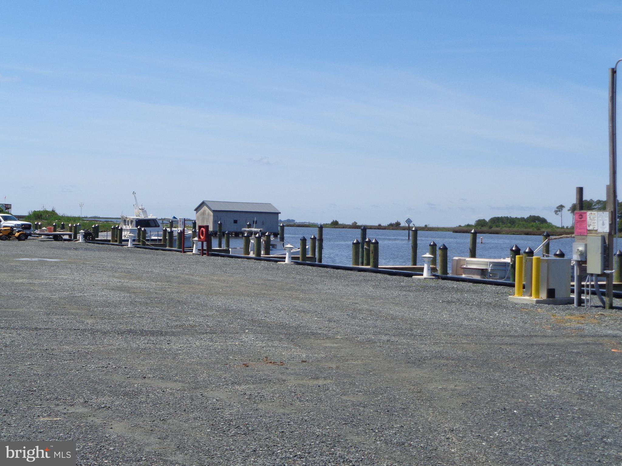 27174 Champ Wharf Road Princess Anne, MD 21853 - Photo 28 of 32 a view of a city street with a large building