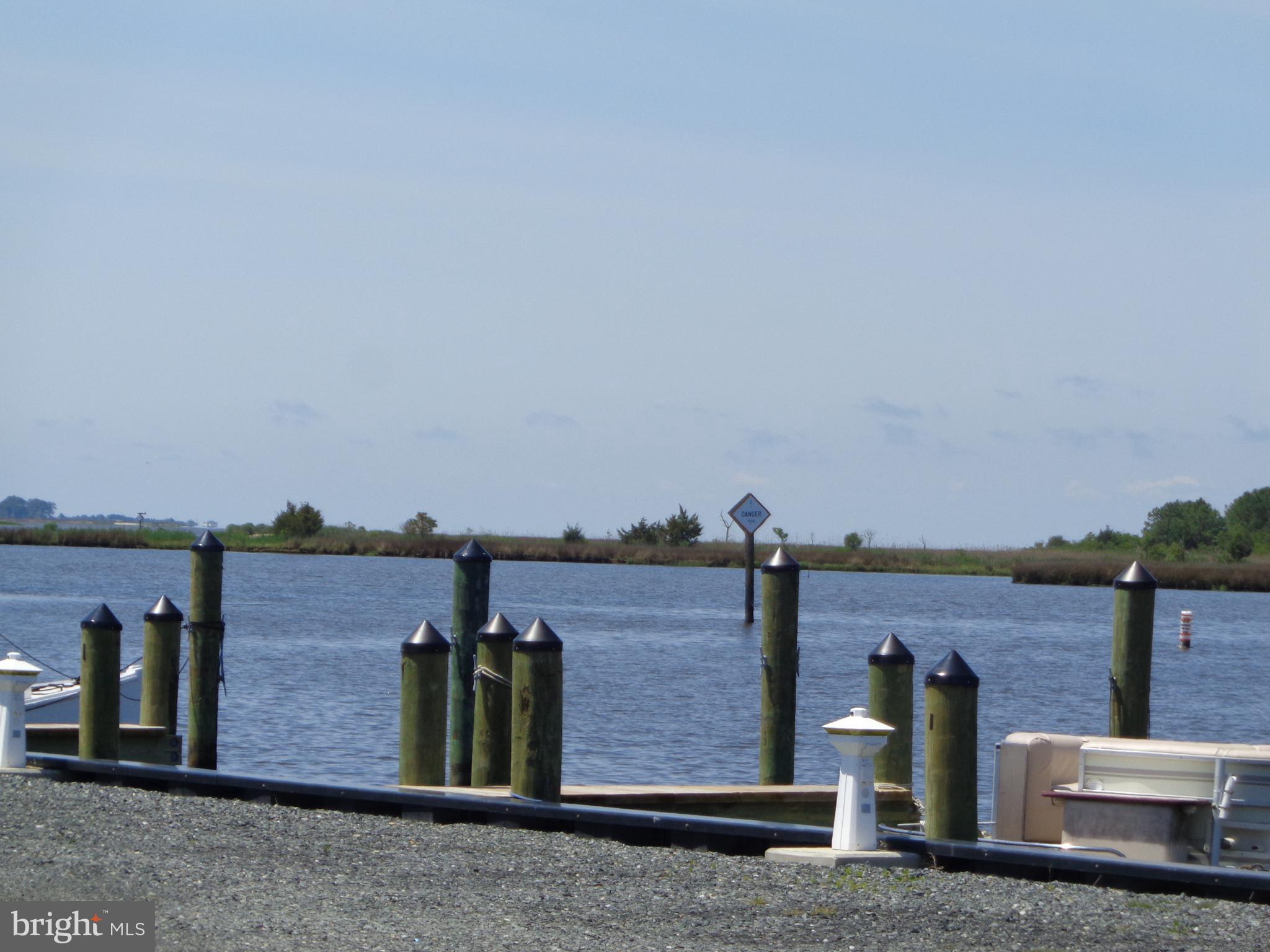 27174 Champ Wharf Road Princess Anne, MD 21853 - Photo 29 of 32 a view of a brick house with an outdoor space