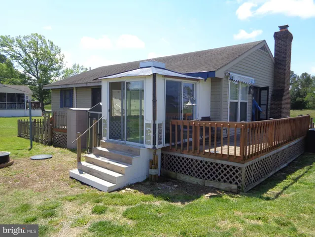 a view of a deck with a yard