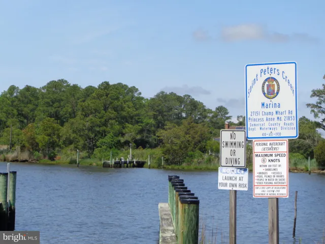 a sign board with a lake view