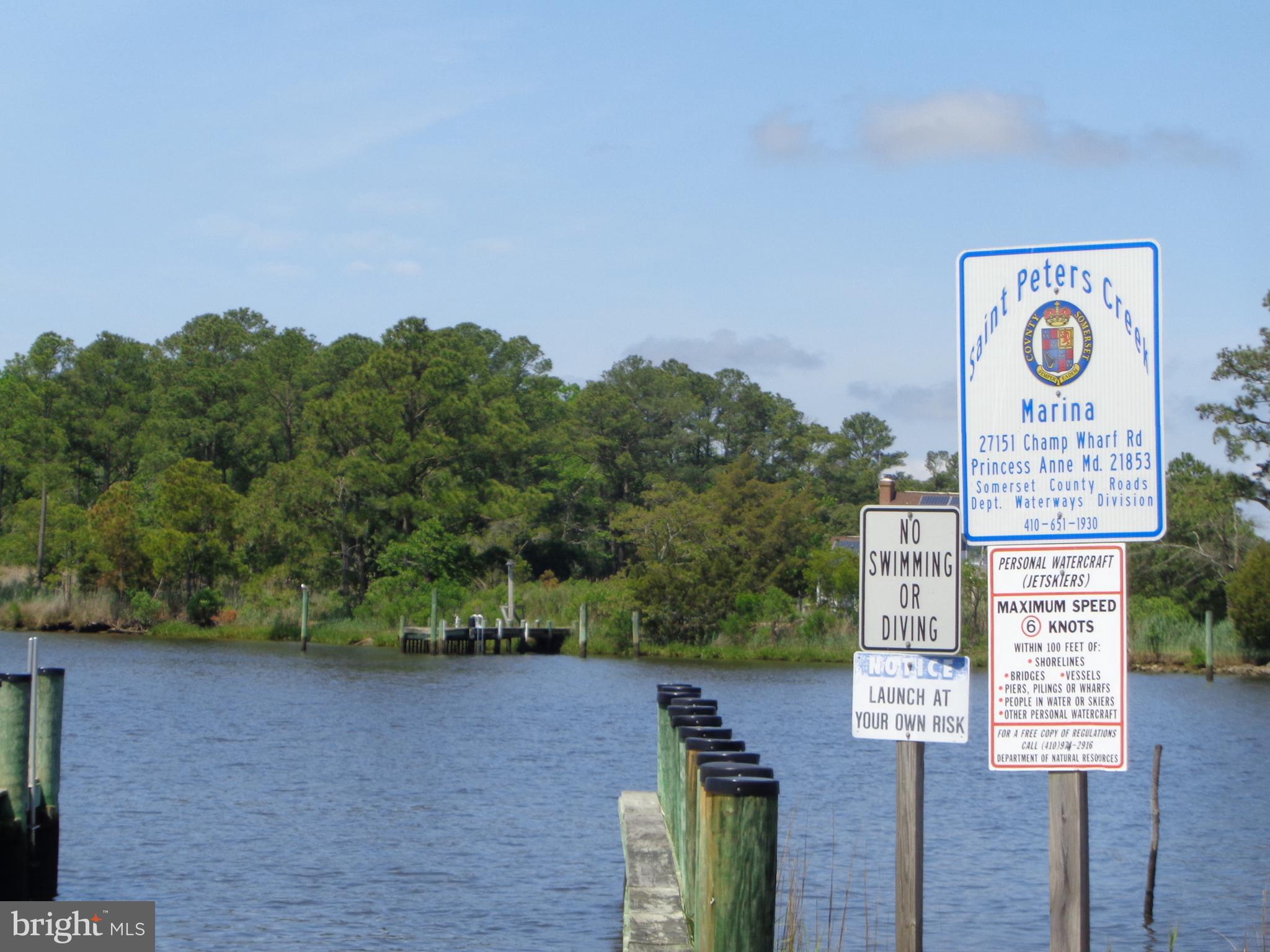 27174 Champ Wharf Road Princess Anne, MD 21853 - Photo 31 of 32 a sign board with a lake view