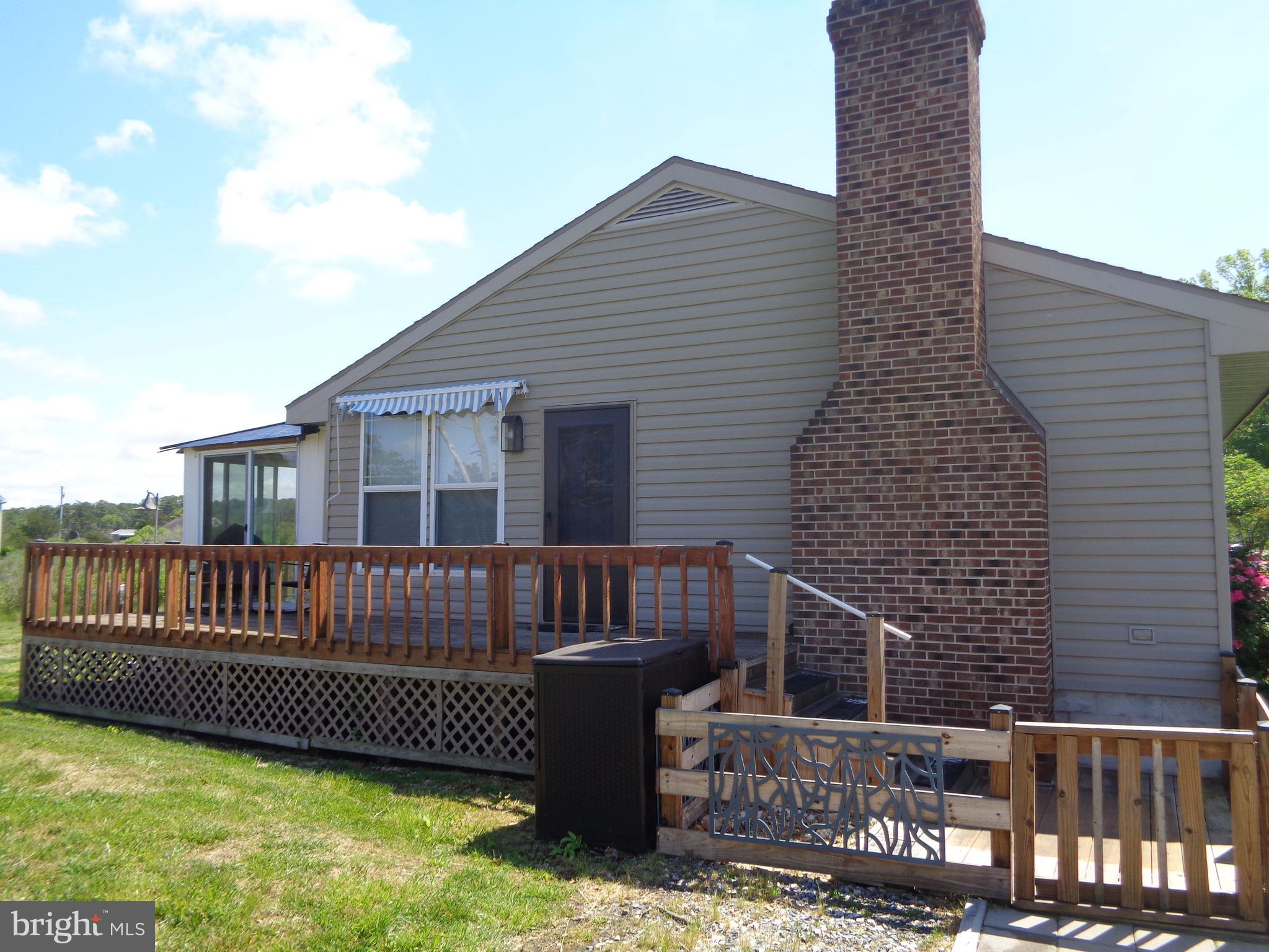 27174 Champ Wharf Road Princess Anne, MD 21853 - Photo 5 of 32 a view of a deck with couches