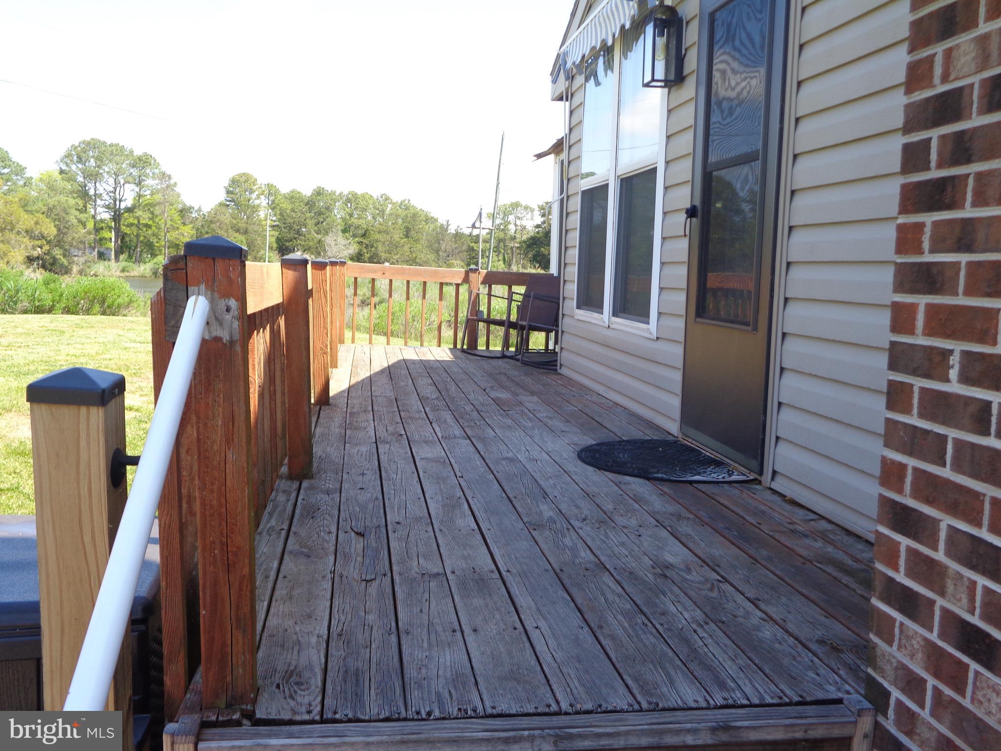27174 Champ Wharf Road Princess Anne, MD 21853 - Photo 7 of 32 a view of balcony with wooden floor and fence
