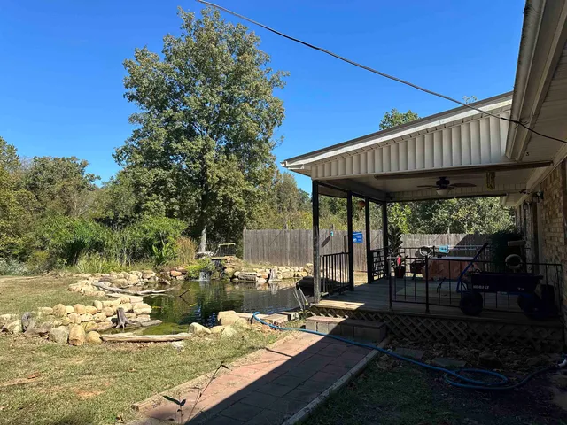 a view of a swimming pool with a patio
