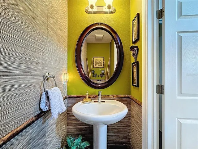 a bathroom with a sink and a mirror