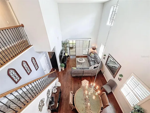 a view of living room with furniture and wooden floor