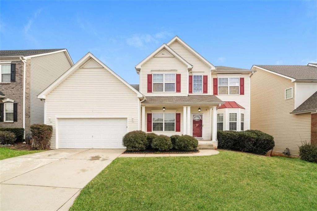 3022 New Haven Lane Villa Rica, GA 30180 - Photo 1 of 1 a front view of a house with a garden