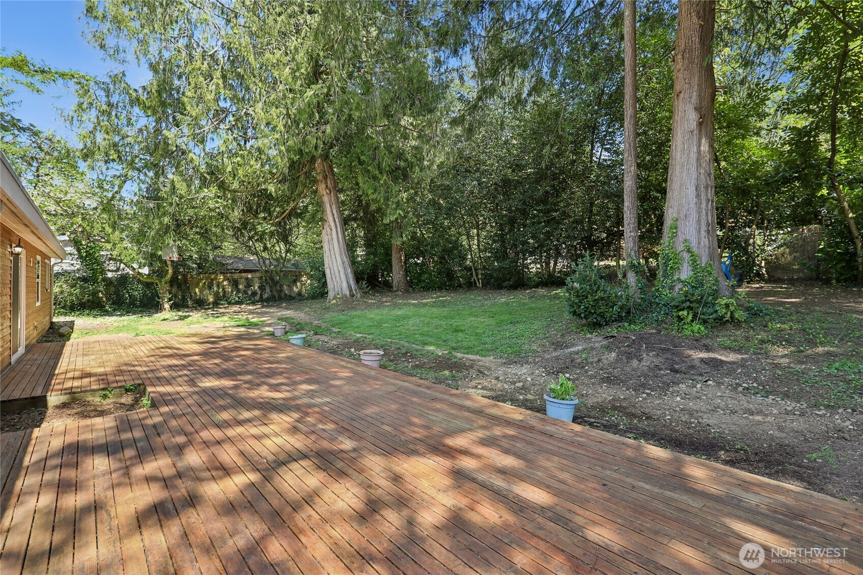 28601 Southeast 225th Street Maple Valley, WA 98038 - Photo 30 of 40 a view of a yard with plants and trees