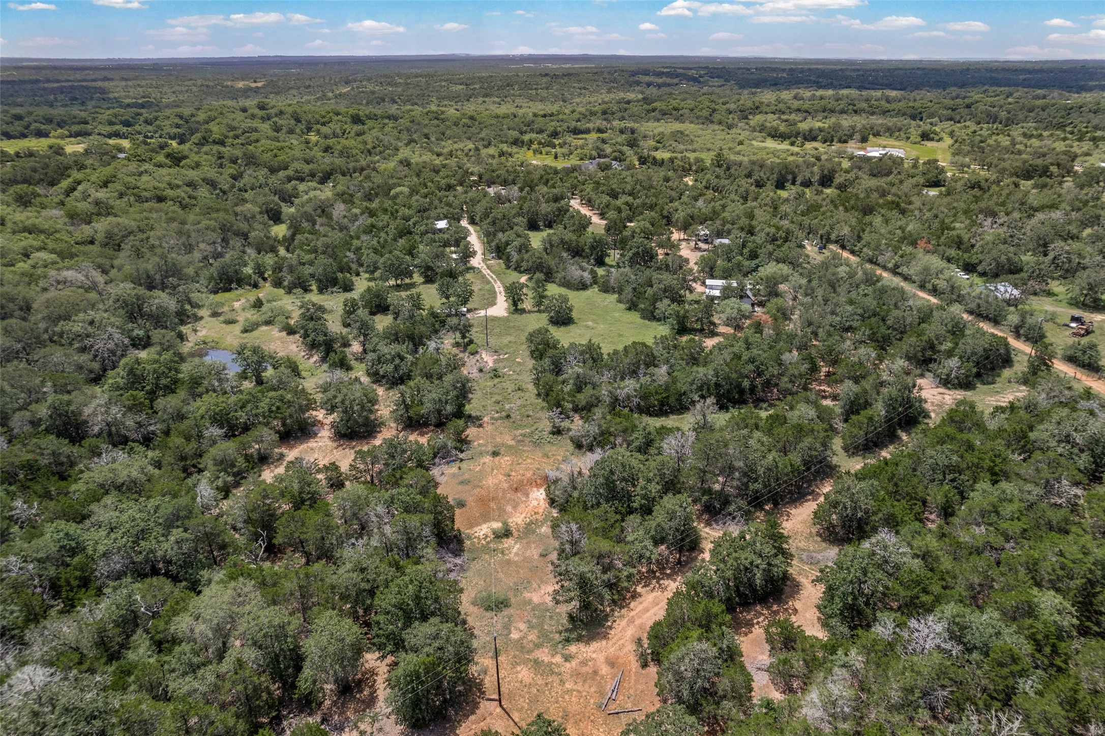 564 Boyd Road Red Rock, TX 78662 - Photo 5 of 25 Acres of wooded land offer privacy and natural beauty, ideal for development or a private estate.