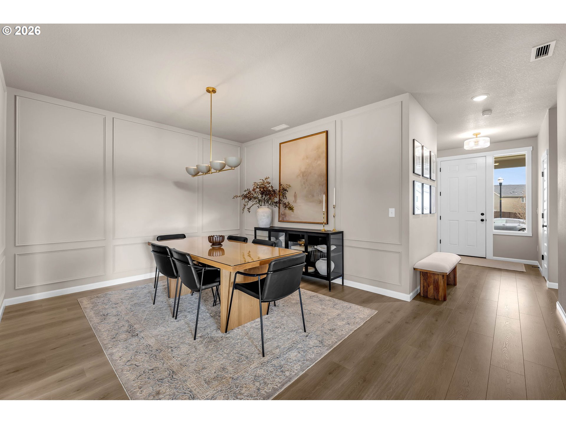 2814 Northwest 8th Place Battle Ground, WA 98604 - Photo 17 of 41 a view of a dining room with furniture and wooden floor