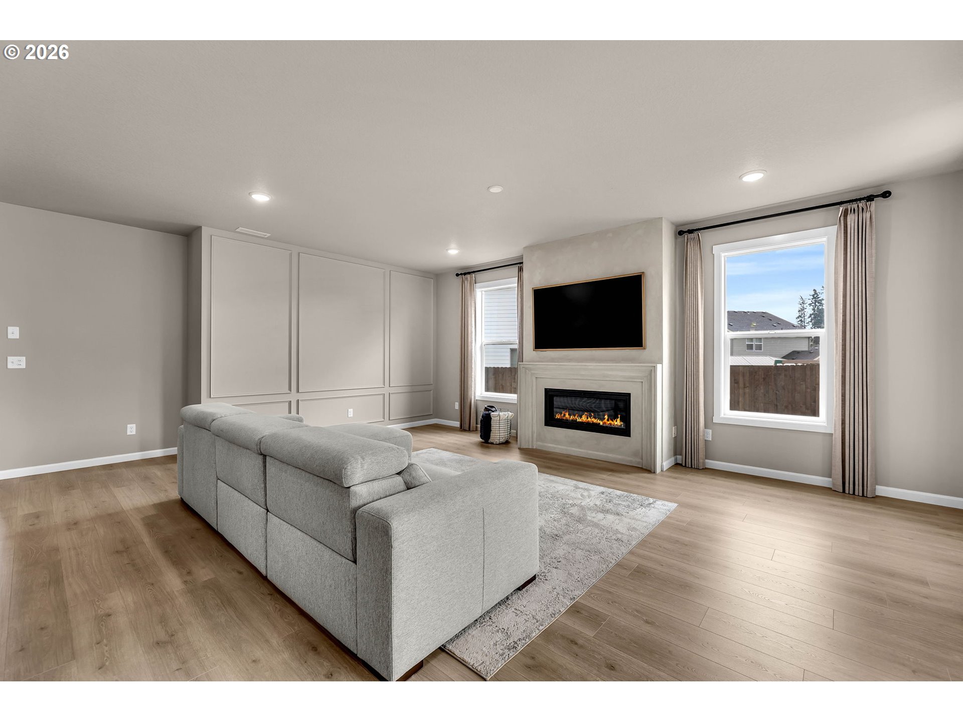 2814 Northwest 8th Place Battle Ground, WA 98604 - Photo 22 of 41 a living room with fireplace furniture and a flat screen tv