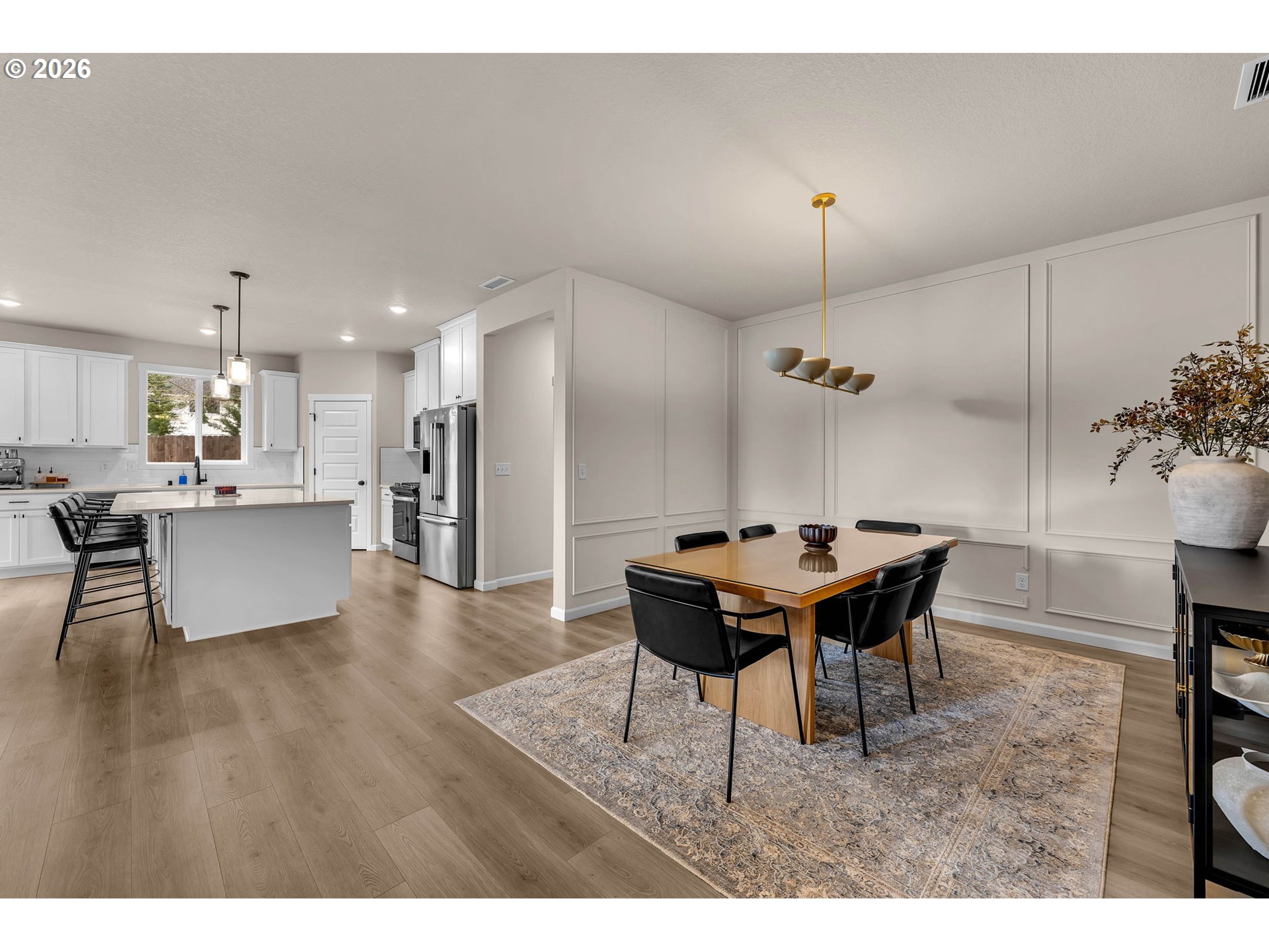 2814 Northwest 8th Place Battle Ground, WA 98604 - Photo 5 of 41 a view of a dining room with furniture and wooden floor
