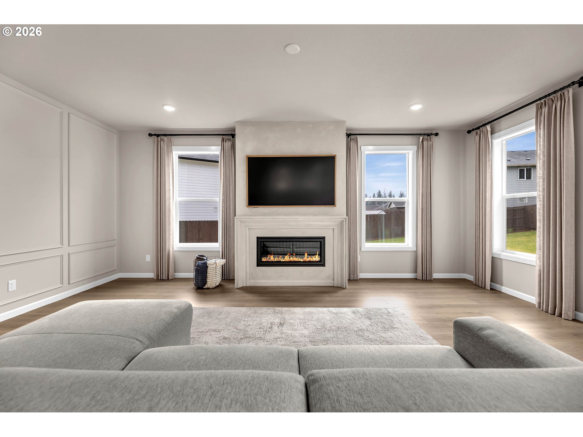 2814 Northwest 8th Place Battle Ground, WA 98604 - Photo 9 of 41 a living room with furniture a fireplace and a flat screen tv