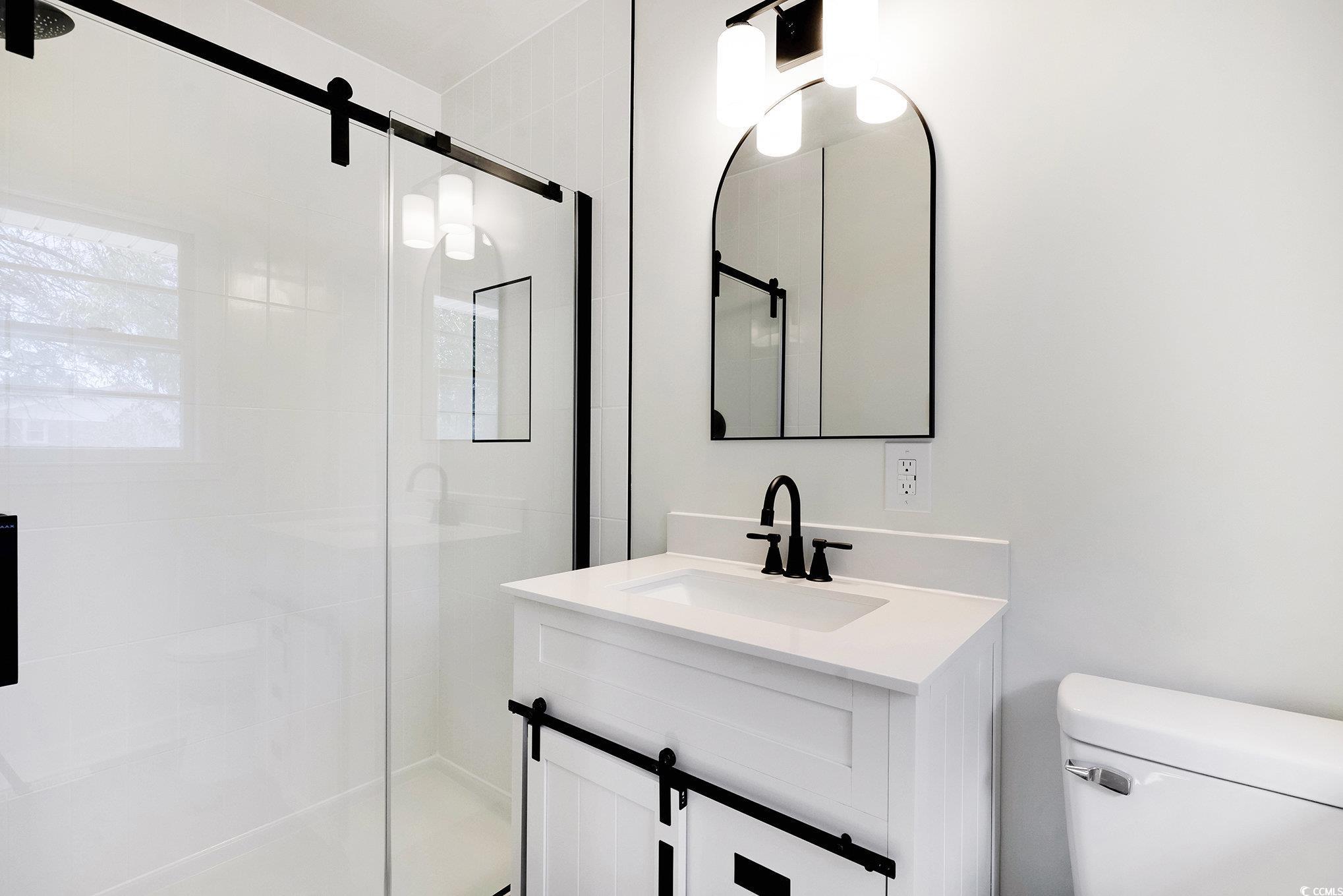 1300 Anderson Street Conway, SC 29526 - Photo 10 of 21 Bathroom with a shower stall and vanity
