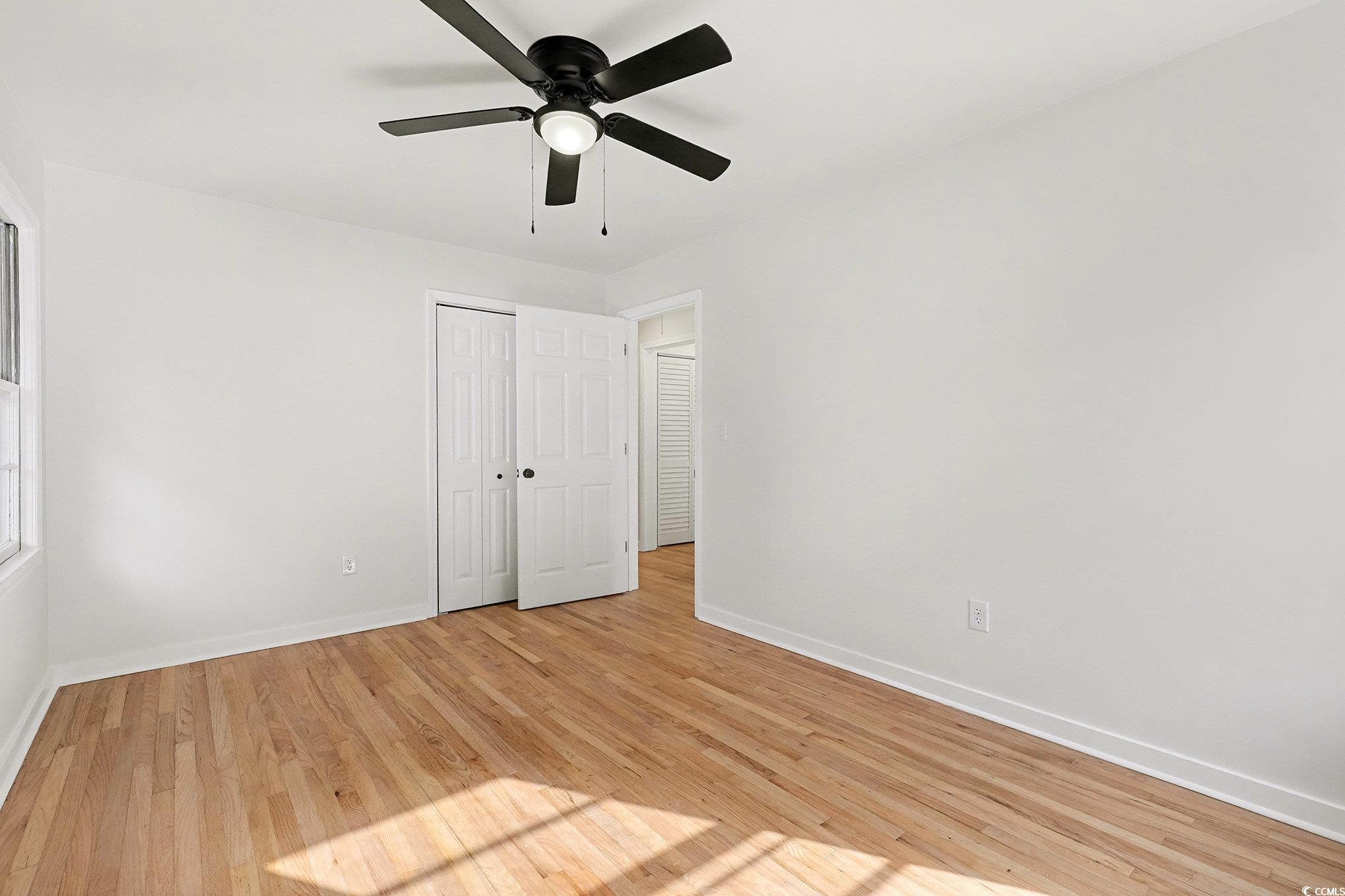 1300 Anderson Street Conway, SC 29526 - Photo 12 of 21 Unfurnished bedroom with light wood finished floors, ceiling fan, and a closet