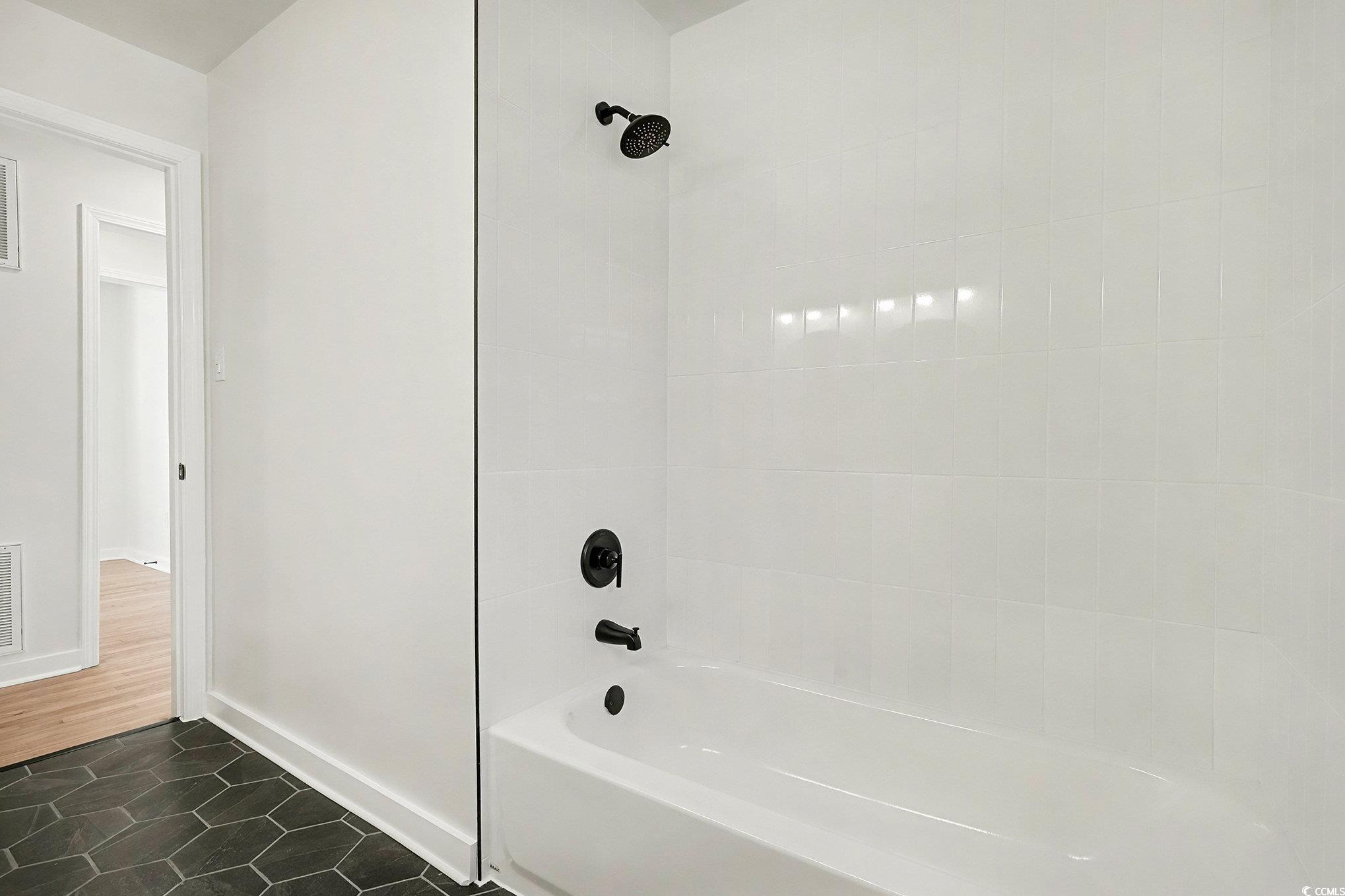 1300 Anderson Street Conway, SC 29526 - Photo 14 of 21 Full bathroom featuring bathtub / shower combination and dark tile patterned flooring