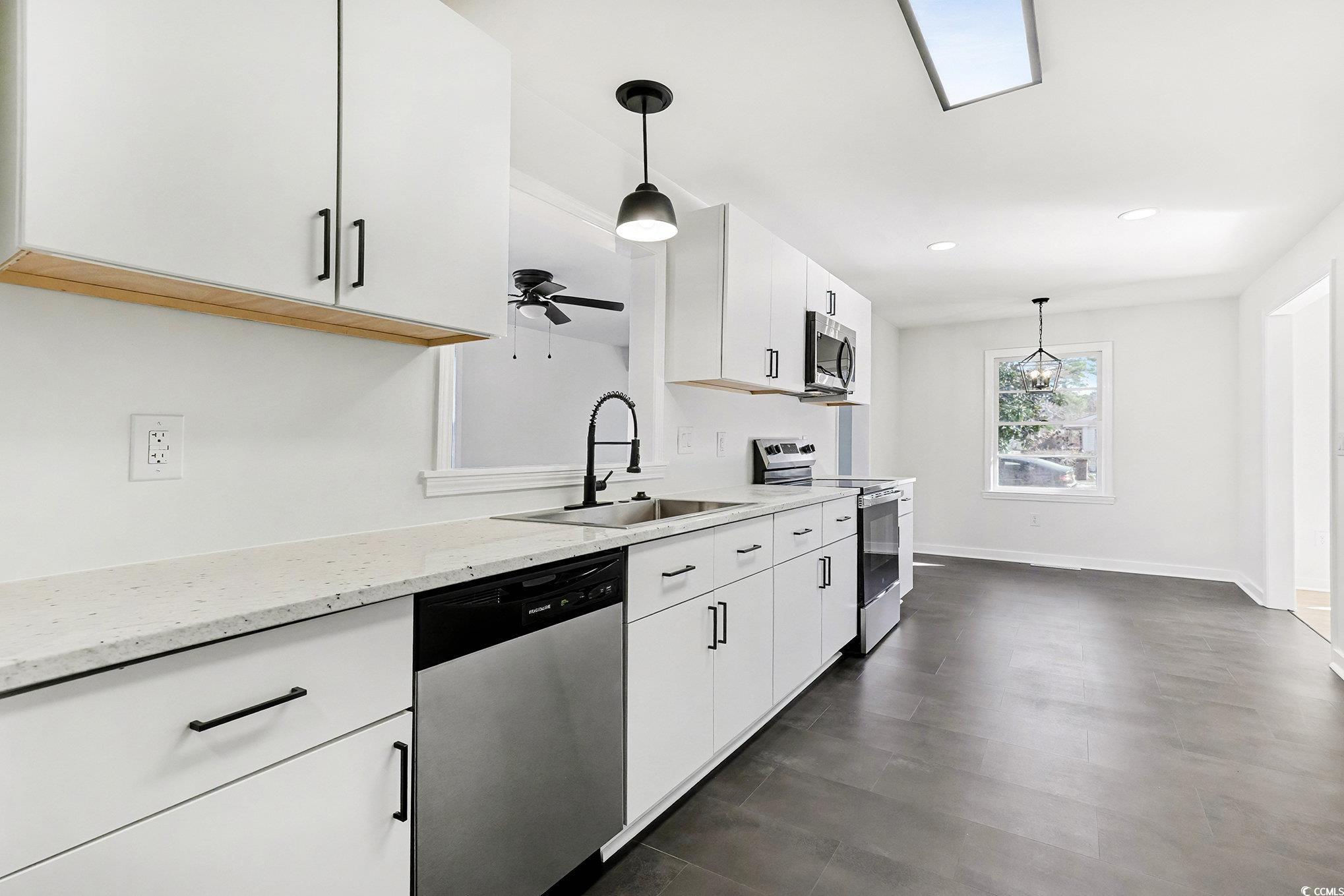 1300 Anderson Street Conway, SC 29526 - Photo 3 of 21 Kitchen with stainless steel appliances, decorative light fixtures, white cabinets, light stone countertops, and recessed lighting