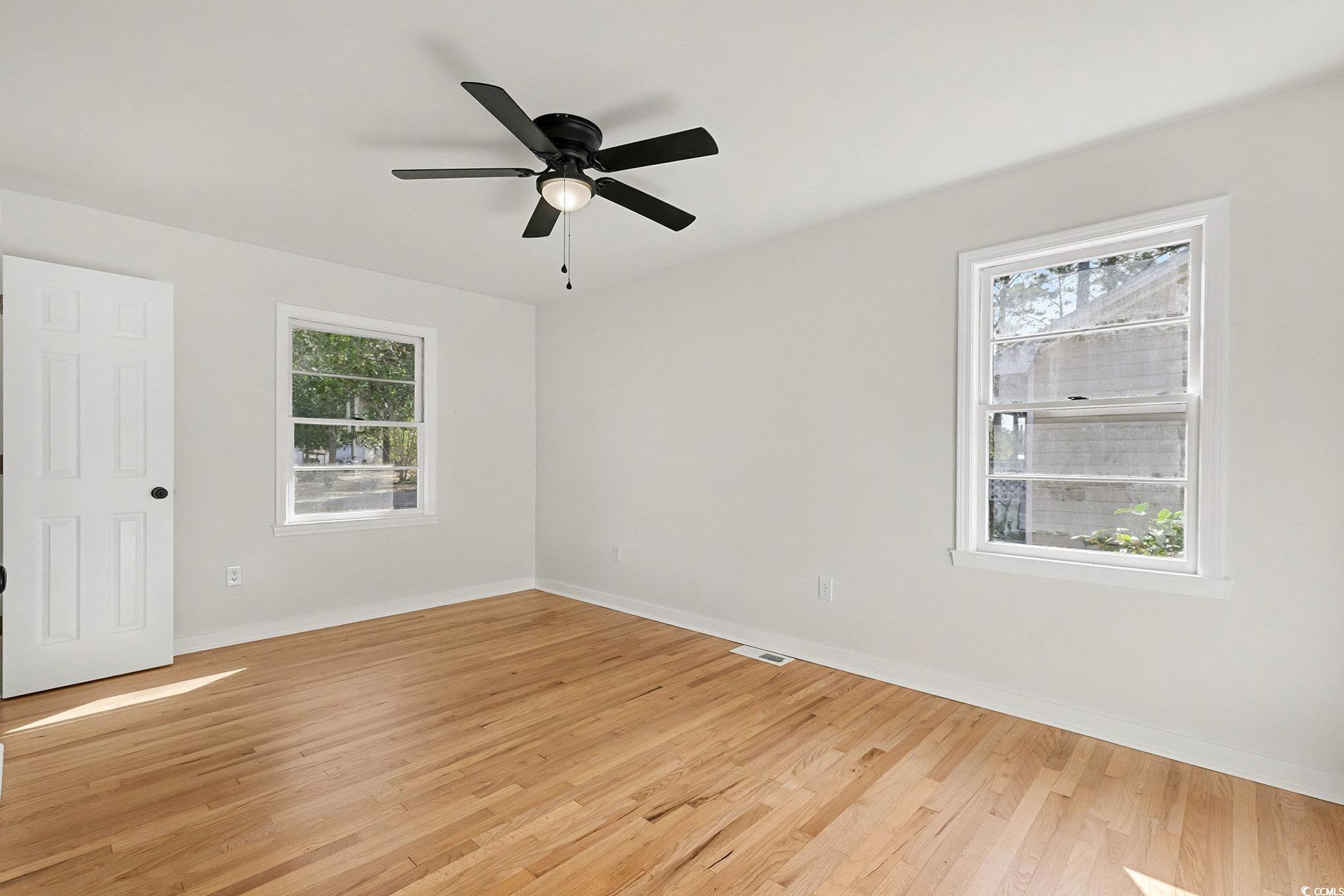 1300 Anderson Street Conway, SC 29526 - Photo 9 of 21 Empty room with light wood-style flooring and a ceiling fan
