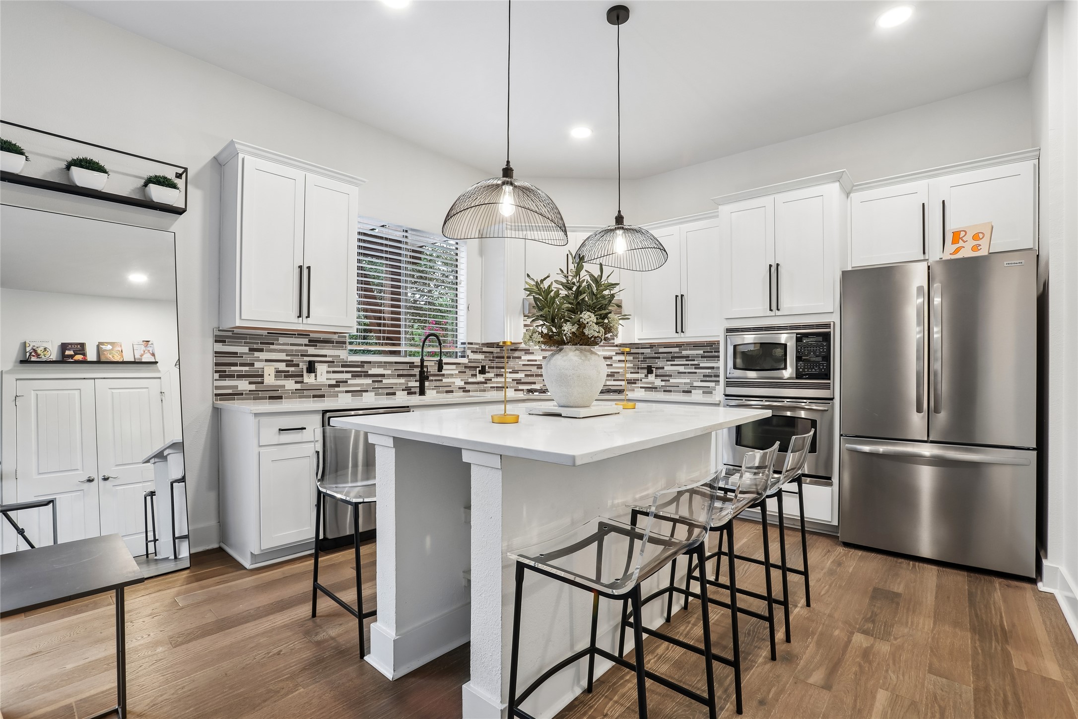 8110 Ranch Road 2222, Unit 10 Austin, TX 78730 - Photo 6 of 23 a kitchen with stainless steel appliances kitchen island a refrigerator and a stove top oven