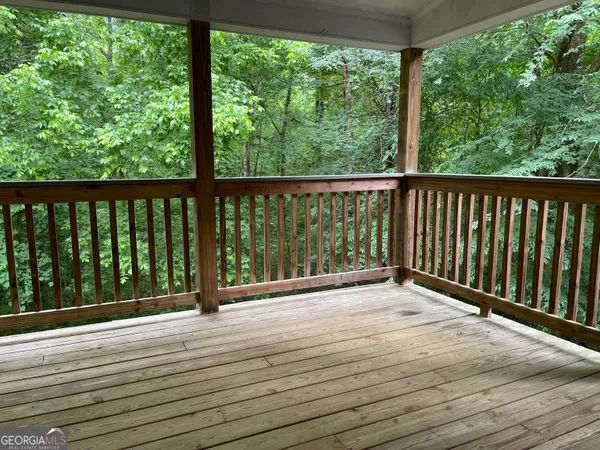 a view of balcony with wooden floor