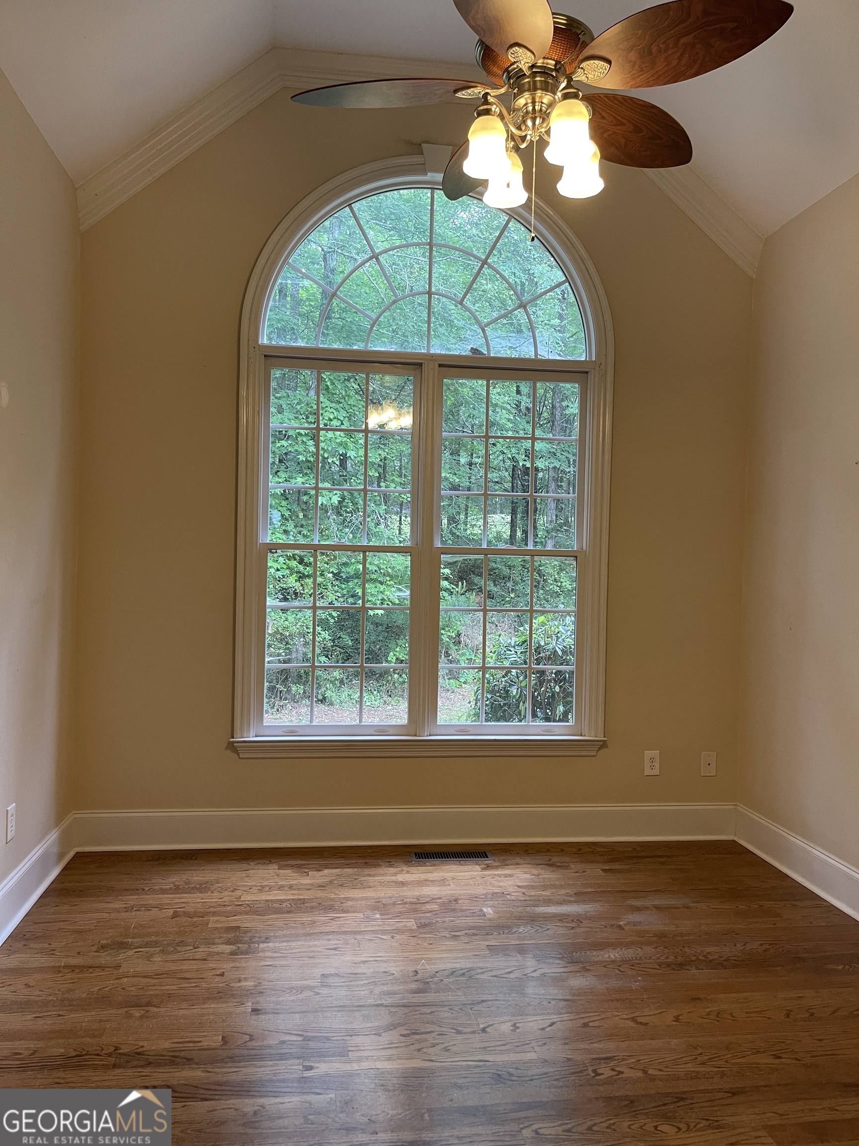 3910 Barnett Shoals Road Athens, GA 30605 - Photo 17 of 30 a view of an empty room with wooden floor and a window