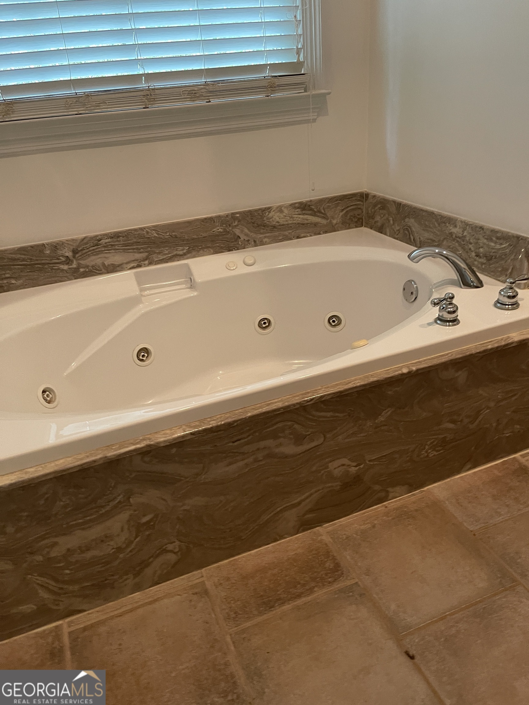 3910 Barnett Shoals Road Athens, GA 30605 - Photo 23 of 30 a bathroom with a bathtub and a shower