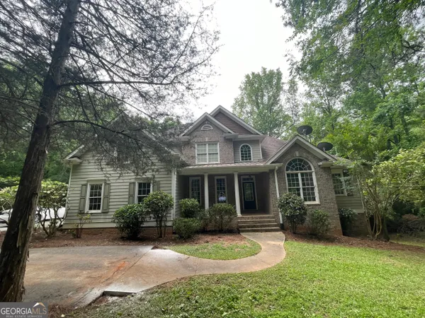 front view of a house with a yard