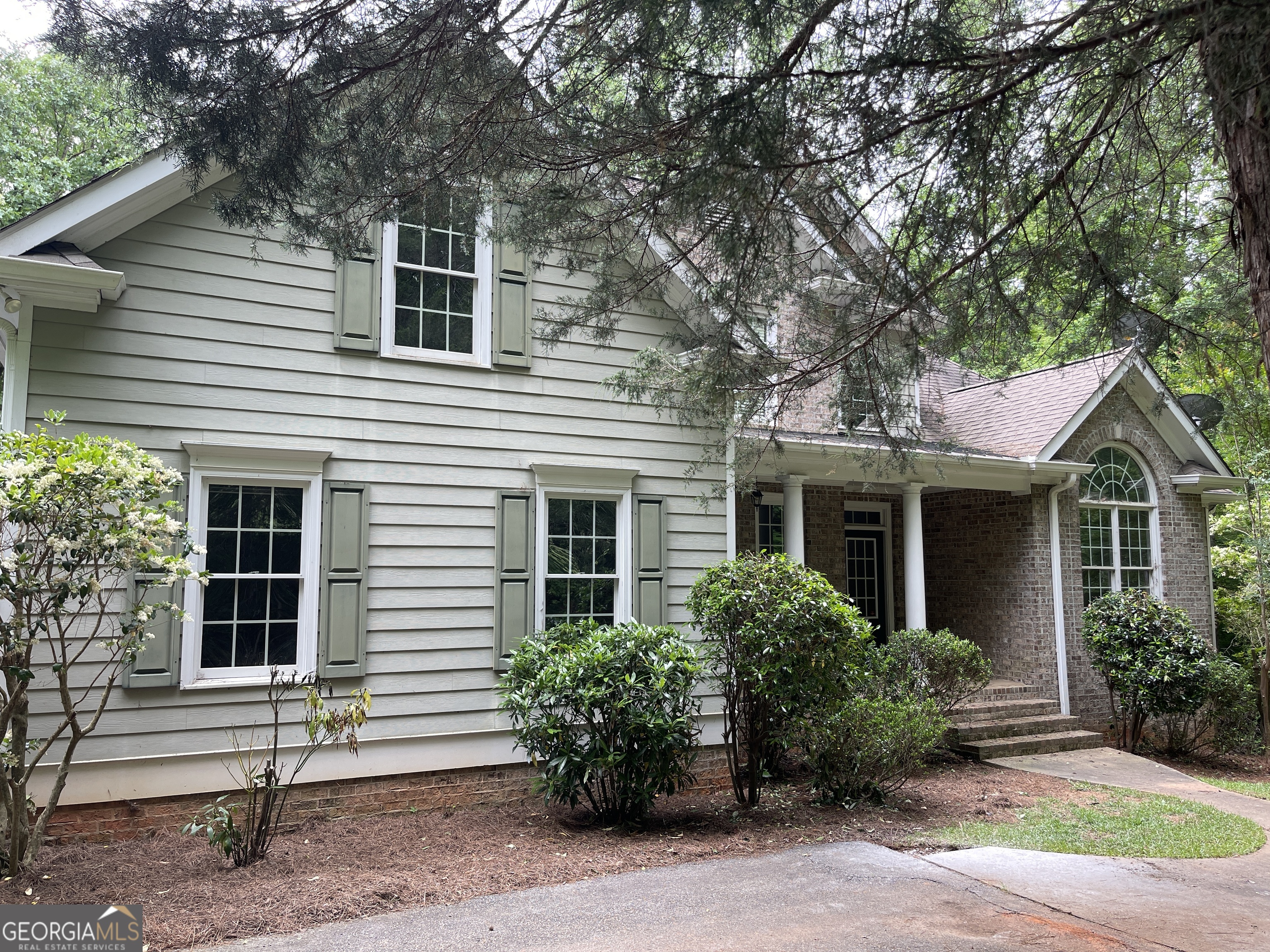3910 Barnett Shoals Road Athens, GA 30605 - Photo 3 of 30 a front view of a house with garden