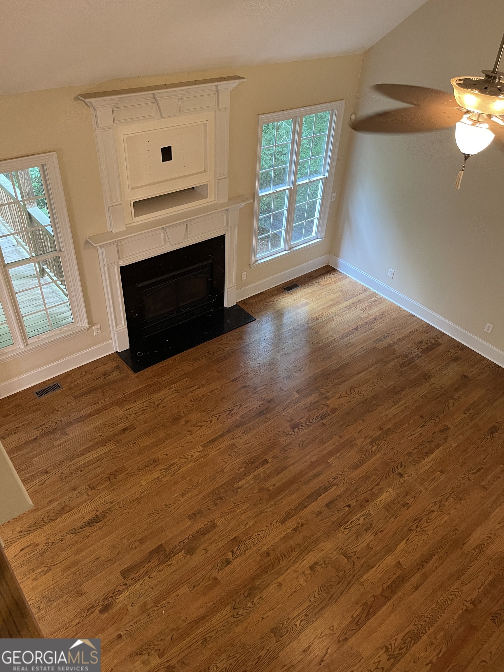 3910 Barnett Shoals Road Athens, GA 30605 - Photo 7 of 30 an empty room with windows and fireplace