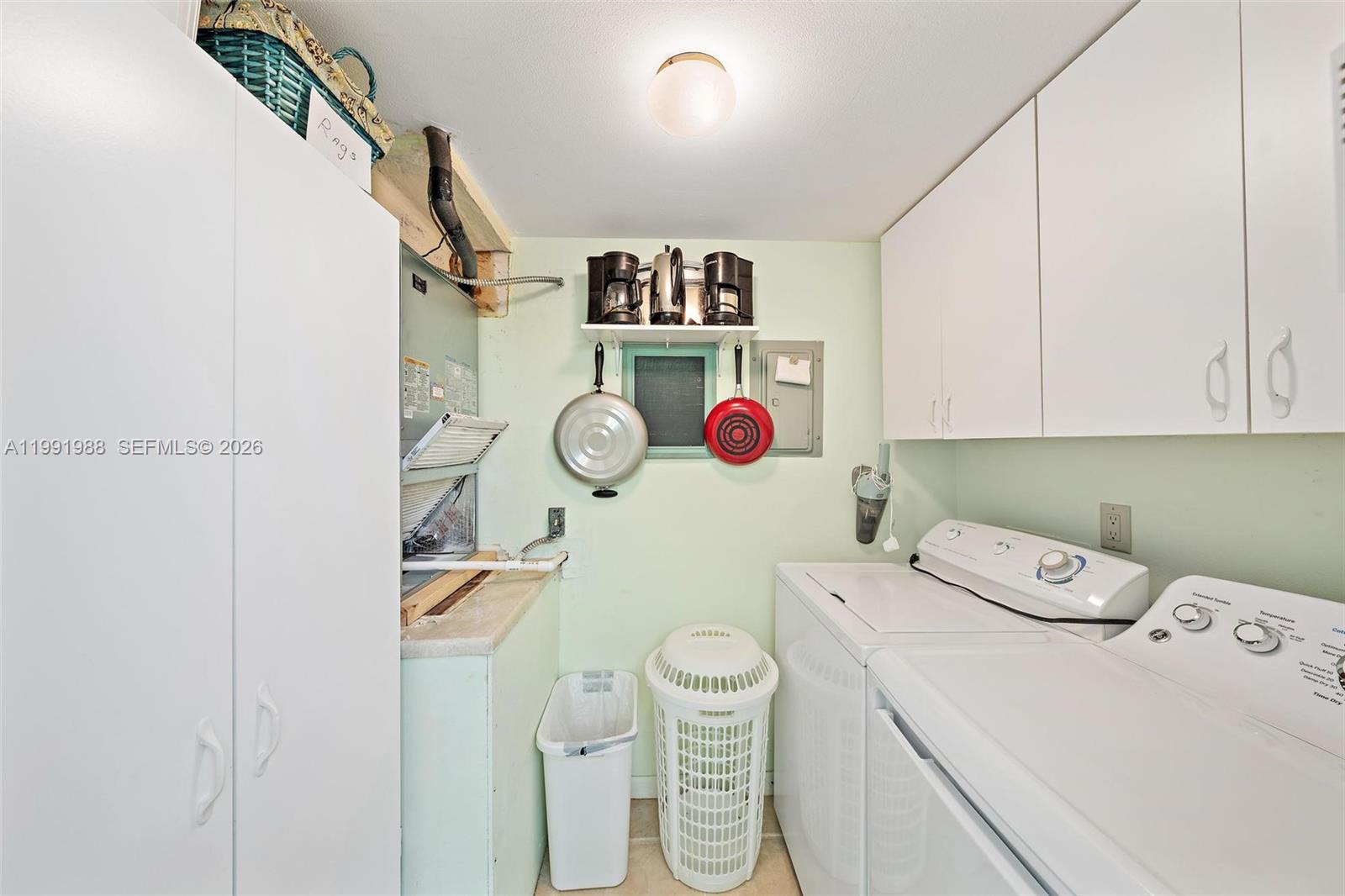 301 Pine Ridge Circle, Unit C1 Greenacres, FL 33463 - Photo 15 of 30 a view of a storage & utility room with a fan