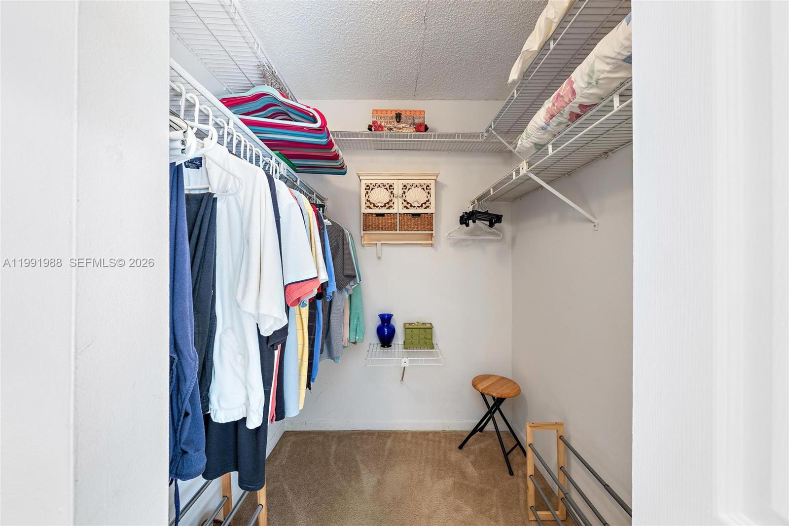 301 Pine Ridge Circle, Unit C1 Greenacres, FL 33463 - Photo 18 of 30 a view of hallway with stairs and wooden floor